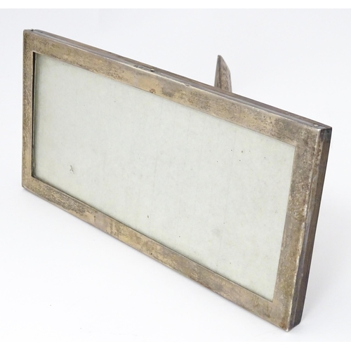 532 - An easel back photograph frame with silver surround hallmarked Birmingham 1920, maker Sanders & Mack... 