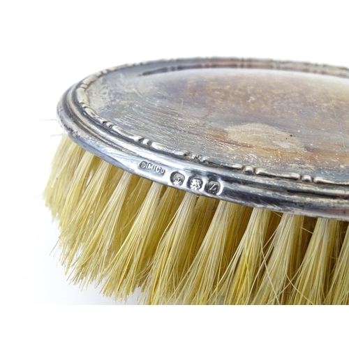 544 - A cased silver brush hallmarked Birmingham 1924, maker Daniel Manufacturing Company. Together with a... 