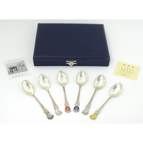 549 - A cased set of six Japanese Export silver spoons to commemorate Expo '70 with enamel decoration to h... 