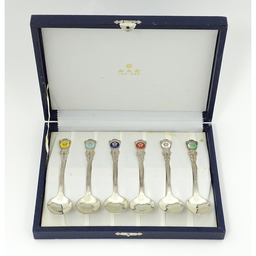 549 - A cased set of six Japanese Export silver spoons to commemorate Expo '70 with enamel decoration to h... 