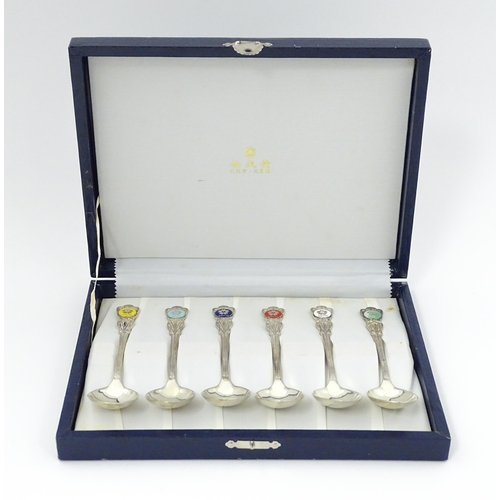 549 - A cased set of six Japanese Export silver spoons to commemorate Expo '70 with enamel decoration to h... 