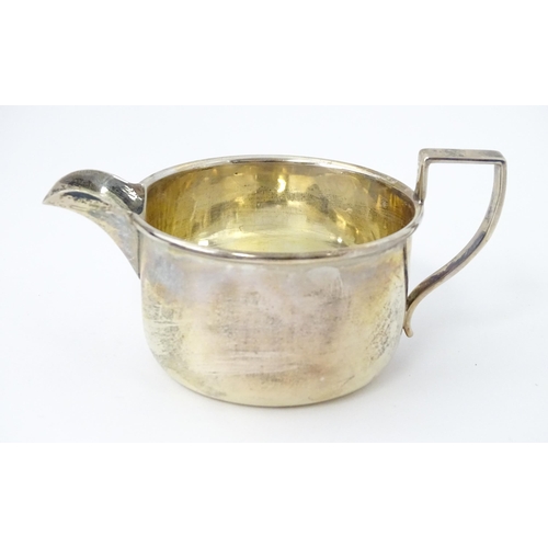 550 - A cased silver sugar bowl and milk jug hallmarked Birmingham 1924, maker George Unite & Sons. Bowl a... 