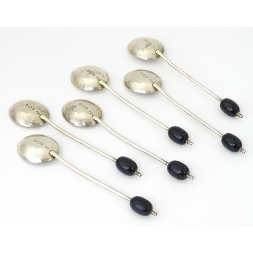 562 - A cased set of six silver coffee spoons with coffee bean finials, hallmarked Birmingham 1934, maker ... 