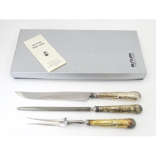 582 - A three piece Kings pattern carving set with silver plate handles, by George Butler of Sheffield Ltd... 