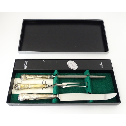 582 - A three piece Kings pattern carving set with silver plate handles, by George Butler of Sheffield Ltd... 