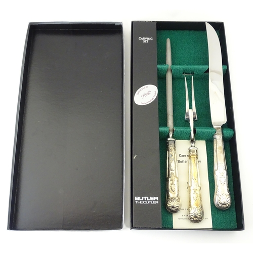 582 - A three piece Kings pattern carving set with silver plate handles, by George Butler of Sheffield Ltd... 