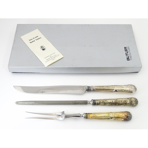 582 - A three piece Kings pattern carving set with silver plate handles, by George Butler of Sheffield Ltd... 