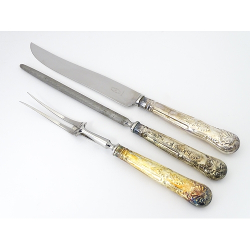 582 - A three piece Kings pattern carving set with silver plate handles, by George Butler of Sheffield Ltd... 