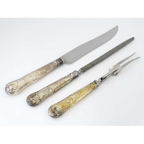 582 - A three piece Kings pattern carving set with silver plate handles, by George Butler of Sheffield Ltd... 