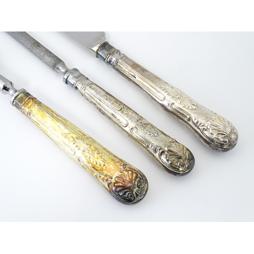 582 - A three piece Kings pattern carving set with silver plate handles, by George Butler of Sheffield Ltd... 