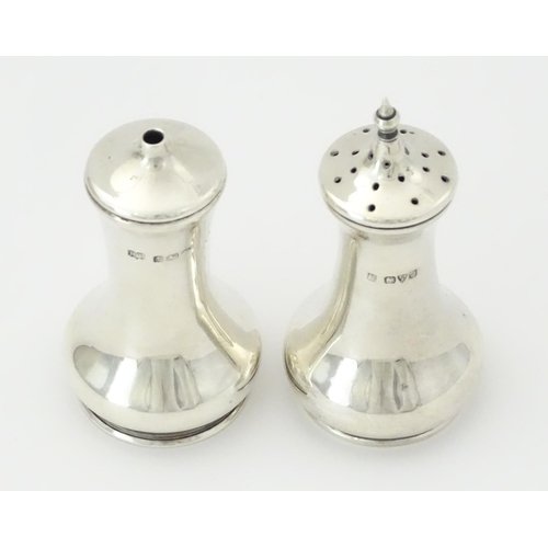 261 - A silver pepperette hallmarked Chester 1909 maker James Deakin & Sons. Together with a silver salt h... 