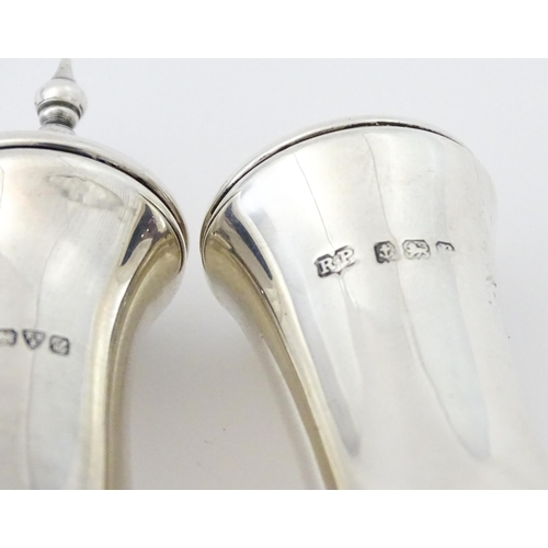 261 - A silver pepperette hallmarked Chester 1909 maker James Deakin & Sons. Together with a silver salt h... 