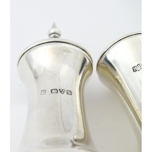 261 - A silver pepperette hallmarked Chester 1909 maker James Deakin & Sons. Together with a silver salt h... 