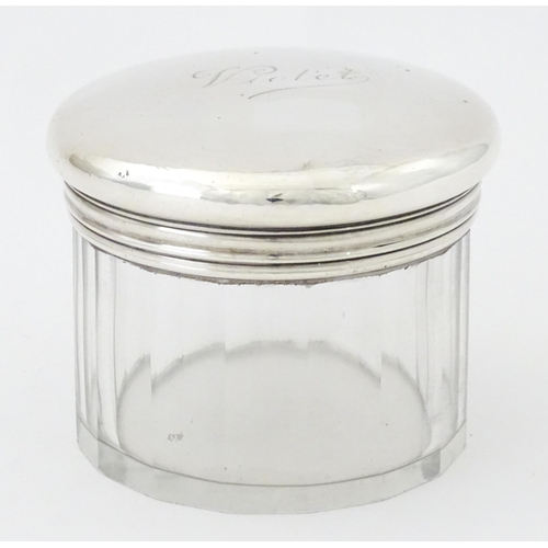 269 - A glass dressing table jar with silver screw top lid hallmarked London 1920, maker Mappin & Webb. Ap... 