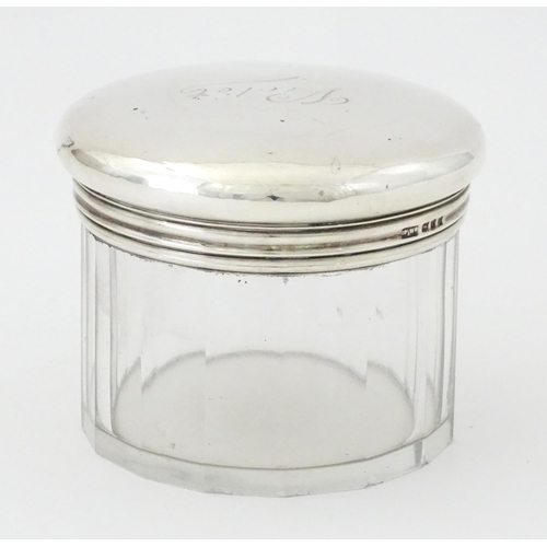 269 - A glass dressing table jar with silver screw top lid hallmarked London 1920, maker Mappin & Webb. Ap... 