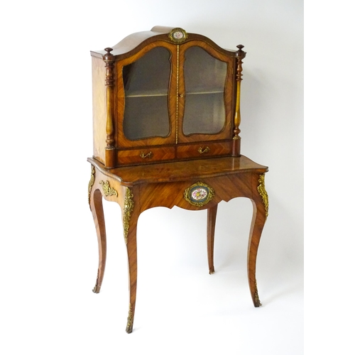 1440 - A mid 19thC Bonheur du jour with burr walnut, walnut and kingwood veneers. The top having a porcelai... 