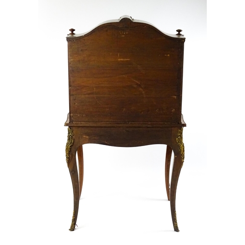 1440 - A mid 19thC Bonheur du jour with burr walnut, walnut and kingwood veneers. The top having a porcelai... 