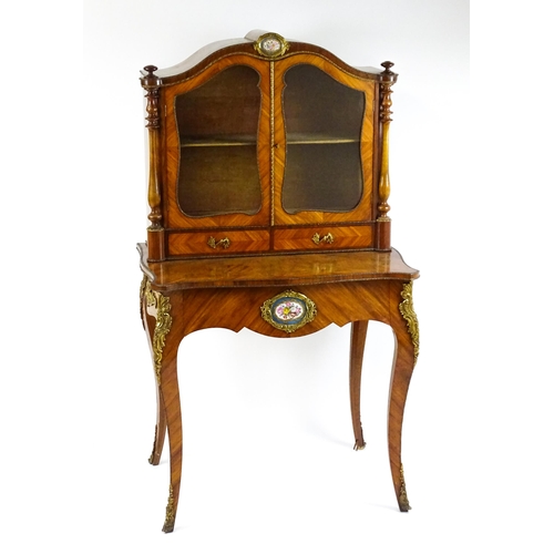 1440 - A mid 19thC Bonheur du jour with burr walnut, walnut and kingwood veneers. The top having a porcelai... 