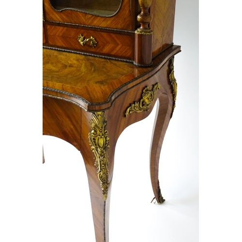 1440 - A mid 19thC Bonheur du jour with burr walnut, walnut and kingwood veneers. The top having a porcelai... 