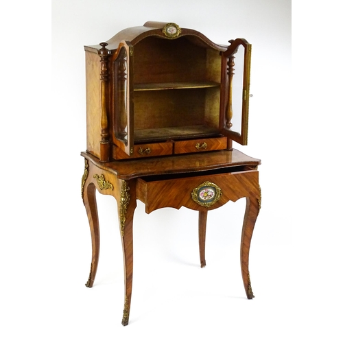 1440 - A mid 19thC Bonheur du jour with burr walnut, walnut and kingwood veneers. The top having a porcelai... 