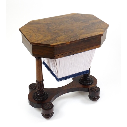 1451 - A William IV rosewood sewing table with an octagonal top above a short drawer and opposing deep well... 