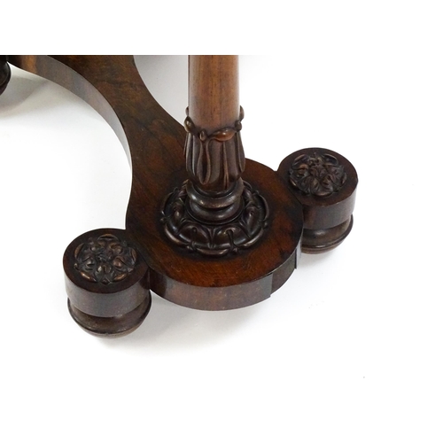 1451 - A William IV rosewood sewing table with an octagonal top above a short drawer and opposing deep well... 