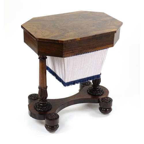 1451 - A William IV rosewood sewing table with an octagonal top above a short drawer and opposing deep well... 