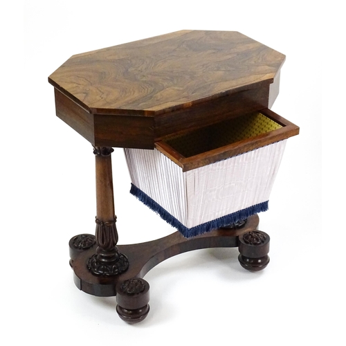 1451 - A William IV rosewood sewing table with an octagonal top above a short drawer and opposing deep well... 