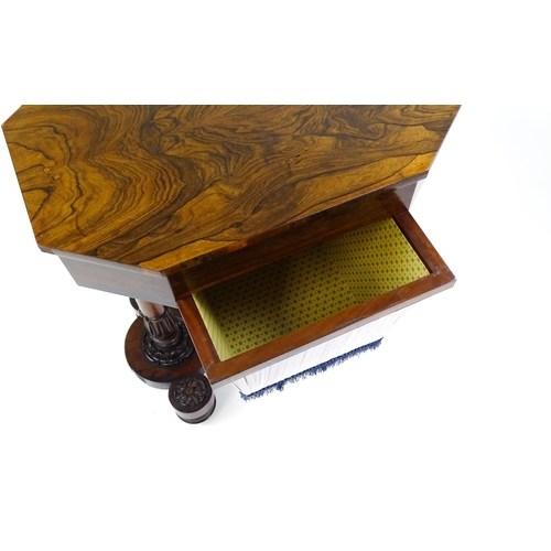 1451 - A William IV rosewood sewing table with an octagonal top above a short drawer and opposing deep well... 