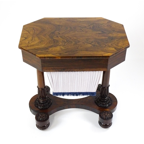 1451 - A William IV rosewood sewing table with an octagonal top above a short drawer and opposing deep well... 