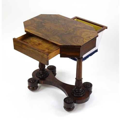 1451 - A William IV rosewood sewing table with an octagonal top above a short drawer and opposing deep well... 