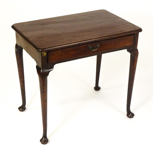 1472 - A George III mahogany side table with re-entrant corners above a single frieze drawer raised on four... 