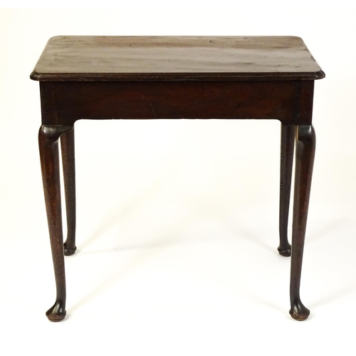 1472 - A George III mahogany side table with re-entrant corners above a single frieze drawer raised on four... 