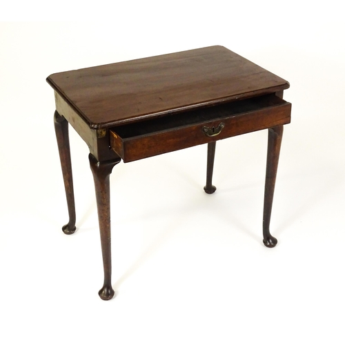 1472 - A George III mahogany side table with re-entrant corners above a single frieze drawer raised on four... 