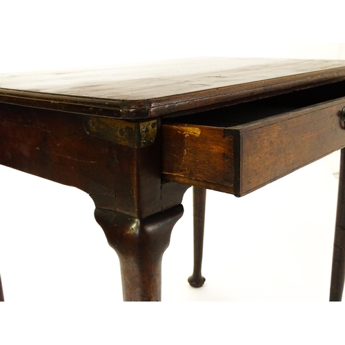 1472 - A George III mahogany side table with re-entrant corners above a single frieze drawer raised on four... 