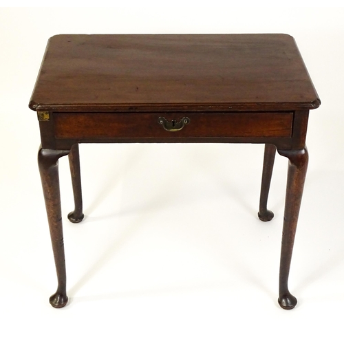 1472 - A George III mahogany side table with re-entrant corners above a single frieze drawer raised on four... 