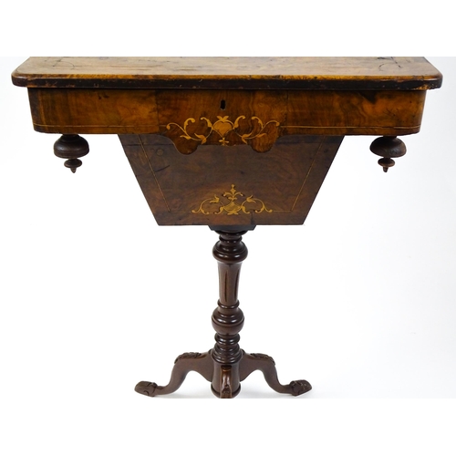 1481 - A late 19thC walnut sewing table with a marquetry inlaid top above an associated turned pedestal rai... 