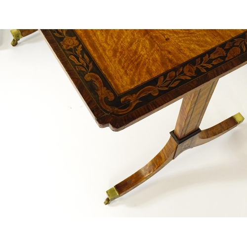 1482 - A pair of early 20thC satinwood library tables with an ebonised surround and floral marquetry decora... 