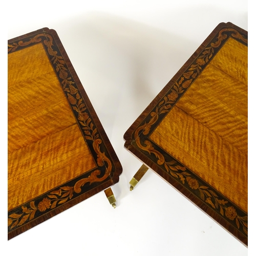 1482 - A pair of early 20thC satinwood library tables with an ebonised surround and floral marquetry decora... 