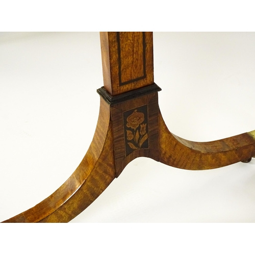 1482 - A pair of early 20thC satinwood library tables with an ebonised surround and floral marquetry decora... 