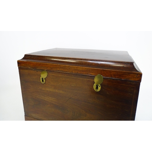 1483 - A mid 19thC mahogany campaign style wine cooler, with a hinged lid opening to show a tin insert. The... 