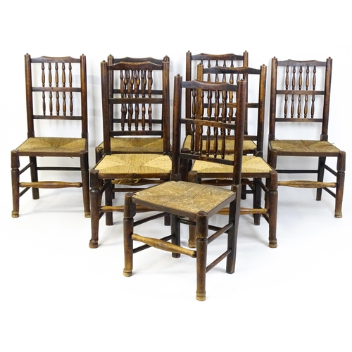 1490 - A group of seven 19thC spindle back dining chairs with envelope rush seats. 18