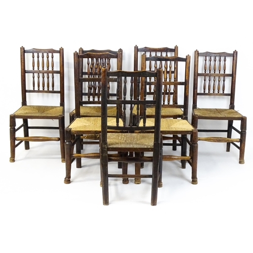 1490 - A group of seven 19thC spindle back dining chairs with envelope rush seats. 18