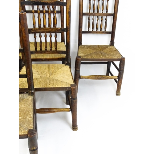 1490 - A group of seven 19thC spindle back dining chairs with envelope rush seats. 18