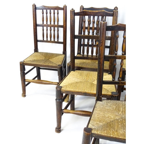 1490 - A group of seven 19thC spindle back dining chairs with envelope rush seats. 18