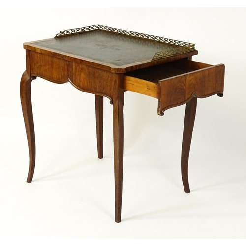 1496 - A 19thC satinwood writing desk surmounted by a bras pierced gallery above a single short drawer with... 