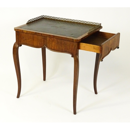 1496 - A 19thC satinwood writing desk surmounted by a bras pierced gallery above a single short drawer with... 