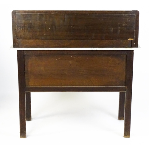 1501 - An early 20thC marble topped washstand with a raised splashback above single panelled door raised on... 