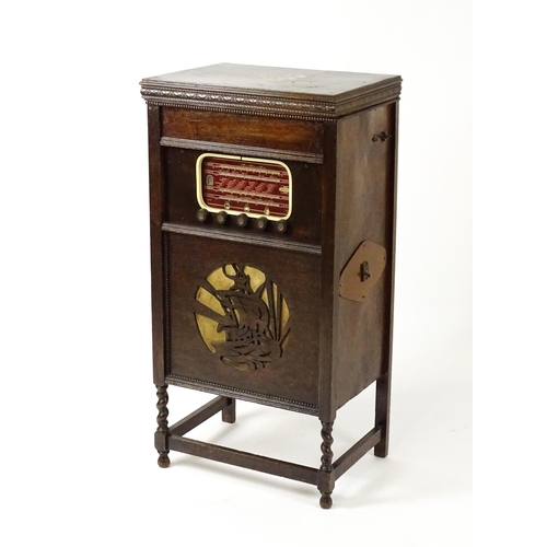 1504 - A c1930s radiogram, the upper section fitted with a Garrard turntable above a Dulci radio tuner and ... 