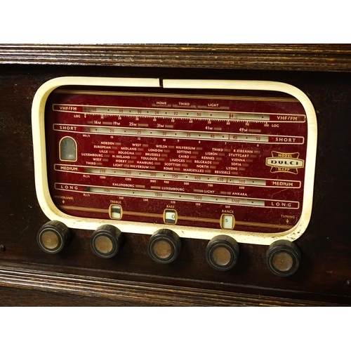 1504 - A c1930s radiogram, the upper section fitted with a Garrard turntable above a Dulci radio tuner and ... 